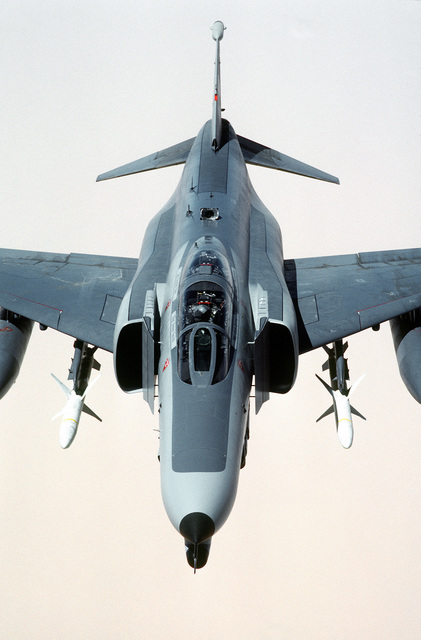 A 35th Tactical Fighter Wing F-4G Phantom II aircraft passes over the ...