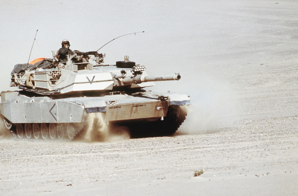 An M-1 Abrams main battle tank moves across the desert during Exercise ...