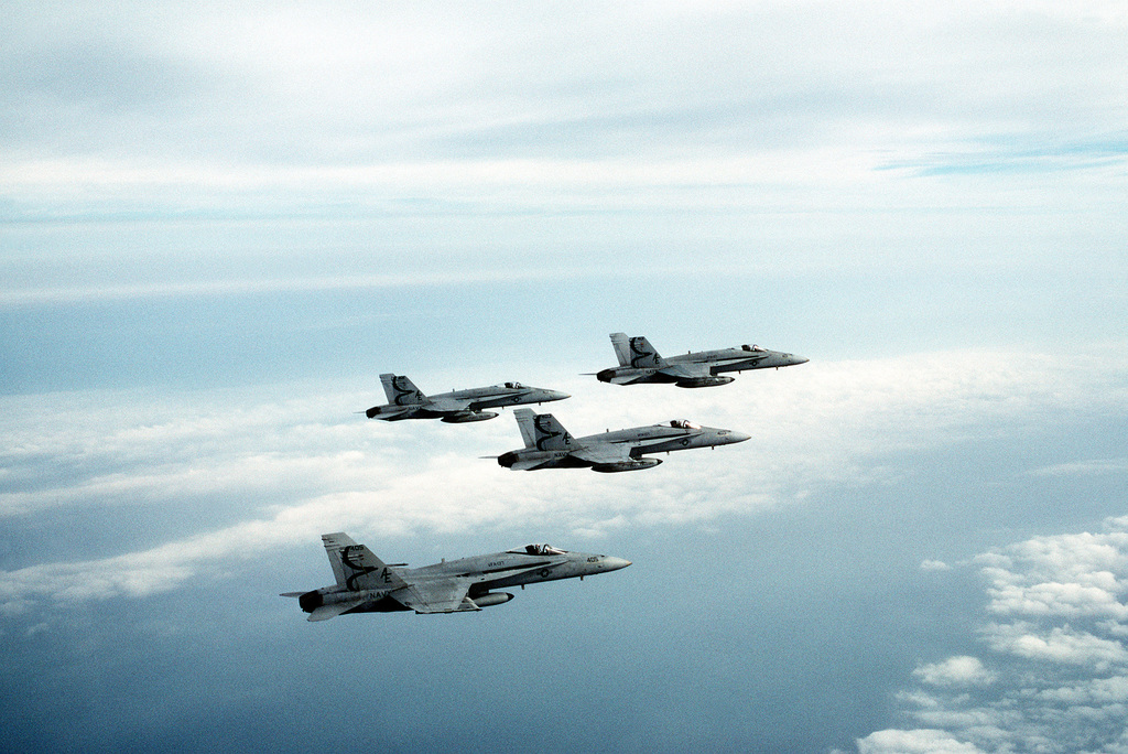 A right side view of four F/A-18A Hornet aircraft from Strike Fighter ...