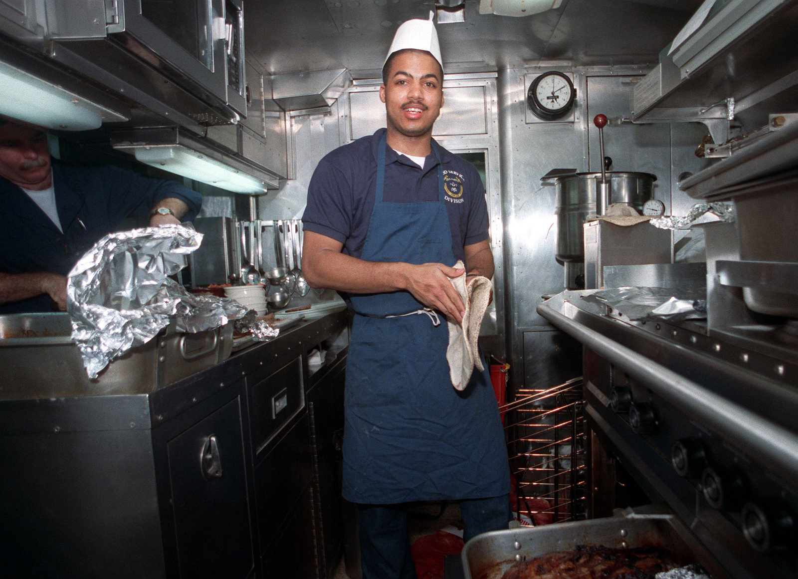 A mess management specialist aboard the nuclear-powered attack ...