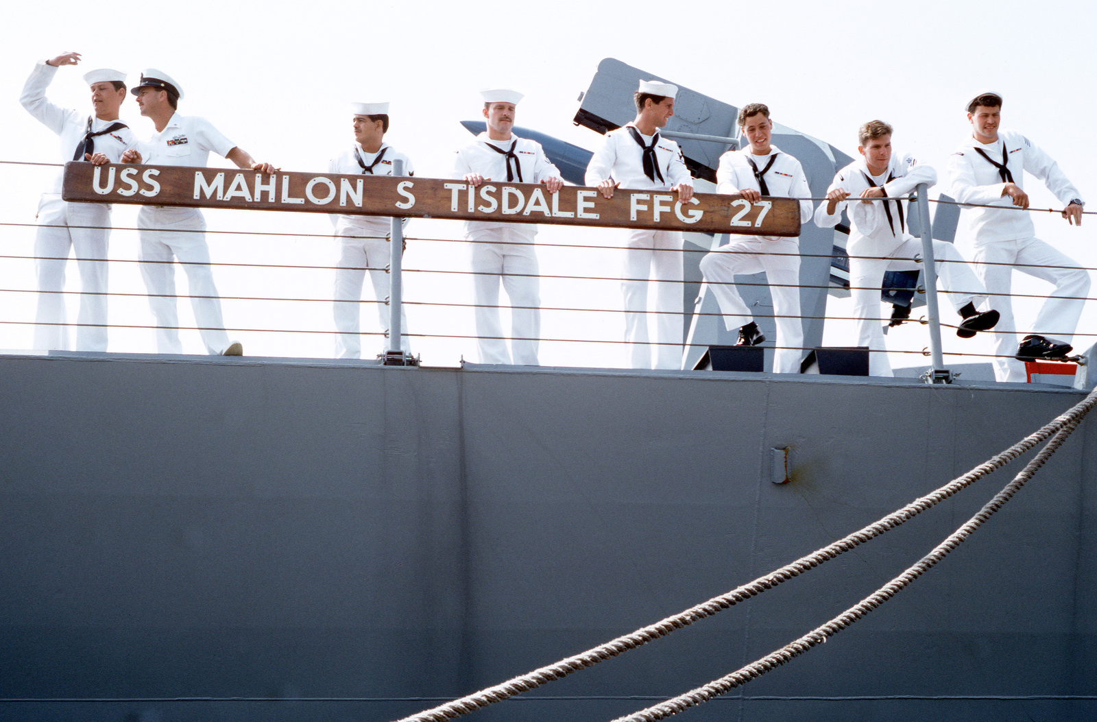 Sailors Look Down From The Railing Aboard The Guided Missile Frigate