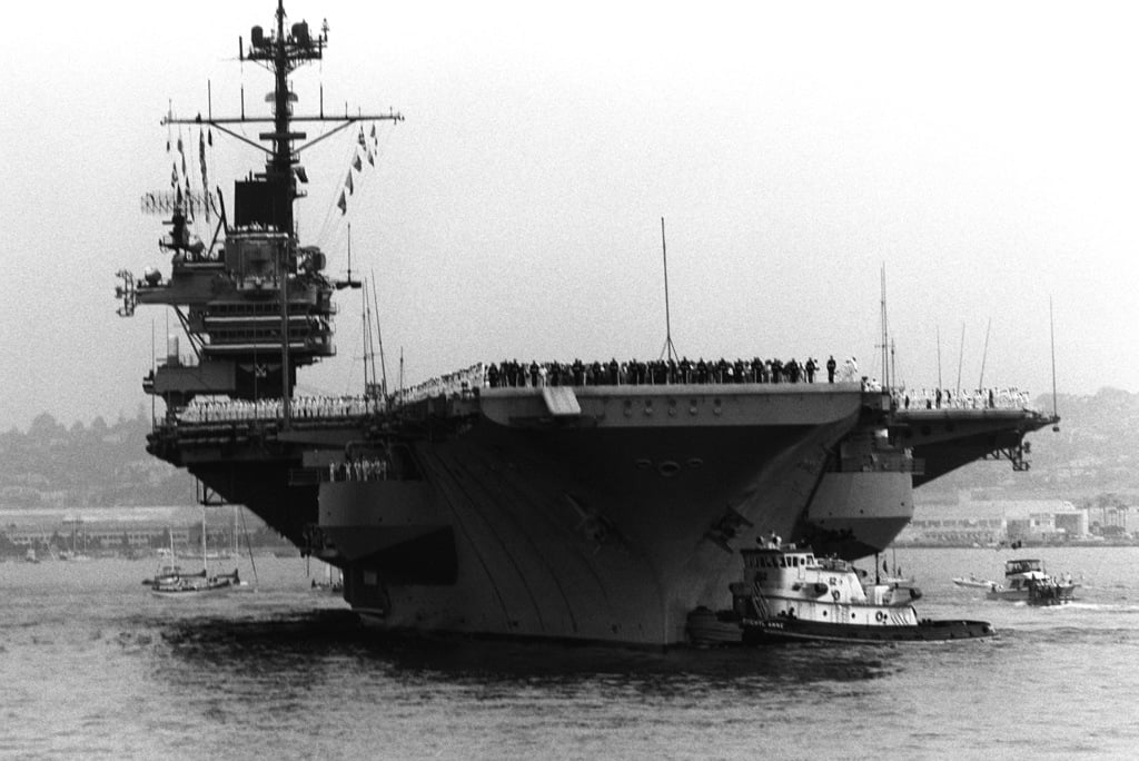 With its crew manning the rails, the aircraft carrier USS RANGER (CV-61 ...