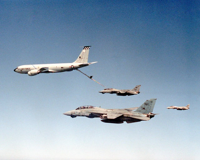 Three F-14A Tomcat aircraft rendezvous with a U.S. Air Force KC-135R ...