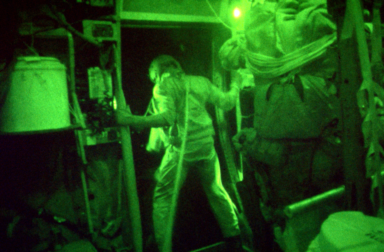 The loadmaster of a 317th Tactical Airlift Wing (TAW) C-130E Hercules ...