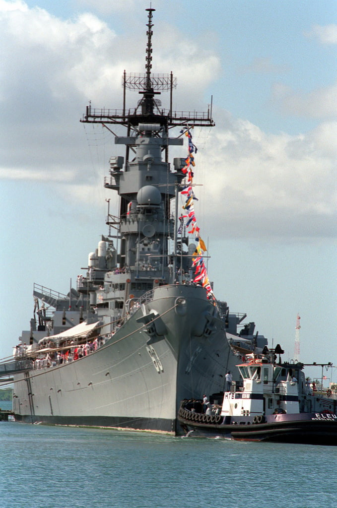 The battleship USS MISSOURI (BB-63) stands moored to a pier following ...