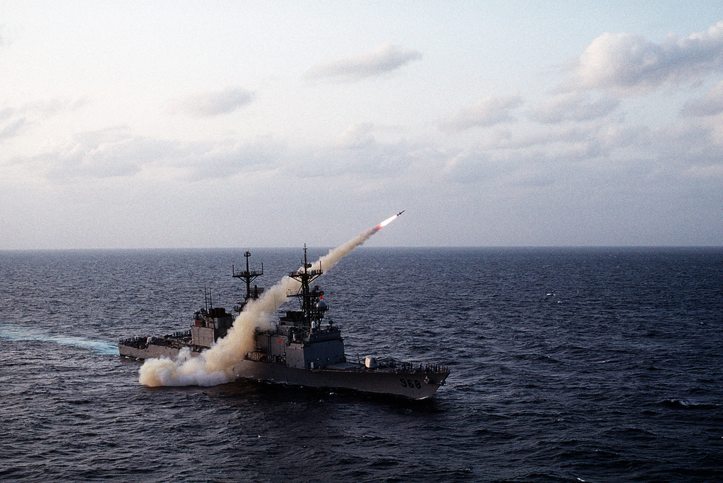 The destroyer USS ARTHUR W. RADFORD (DD-968) fires a Harpoon missile ...