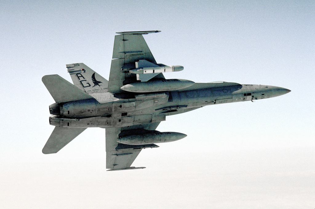 An air-to-air, underside view of an F/A-18C Hornet from Strike Fighter ...