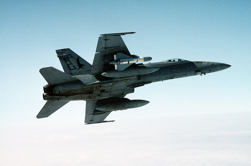 An air-to-air, underside view of an F/A-18C Hornet from Strike Fighter ...