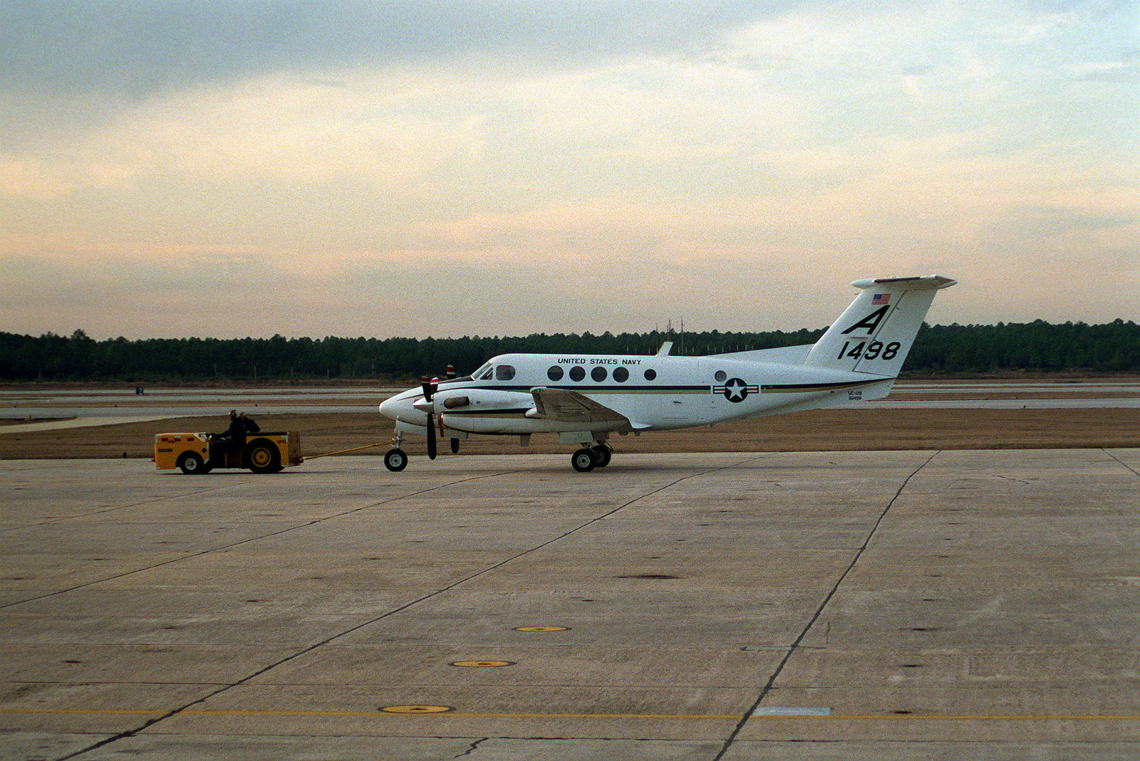 An MD-3A Tow Tractor Tows A Training Wing 1 UC-12B Huron Aircraft ...