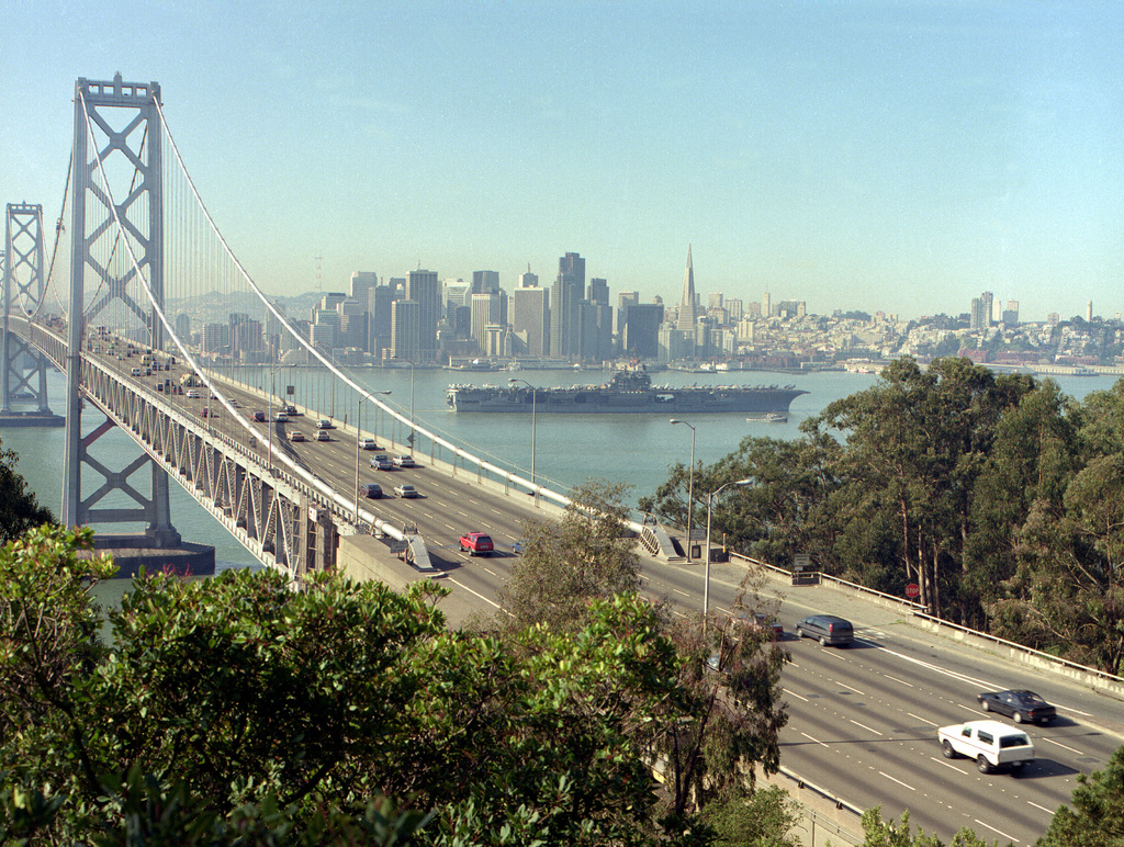 A harbor tug escorts the aircraft carrier USS RANGER (CV-61) past the  Oakland Bay Bridge - PICRYL - Public Domain Media Search Engine Public  Domain Search