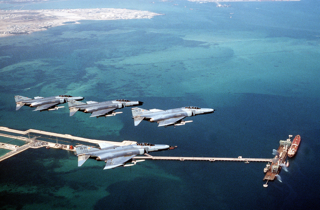 F-4G Phantom fighter aircraft from the 35th Tactical Fighter Wing, Tactical  Air Command, fly over the coastline of Bahrain during Operation Desert  Shield. The aircraft are armed with AGM-88 high-speed, anti-radiation,  air-to-surface