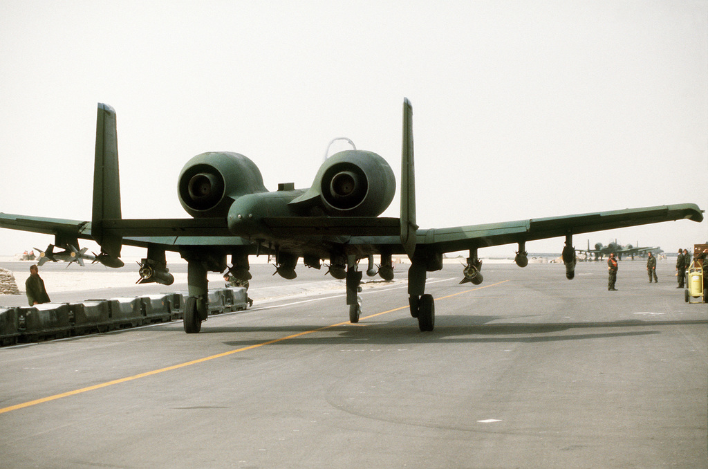 An A-10A Thunderbolt II attack aircraft from the 23rd Tactical Fighter Wing  of England Air Force Base, La., armed with bombs and missiles, is prepared  for a mission during Operation Desert Storm. 