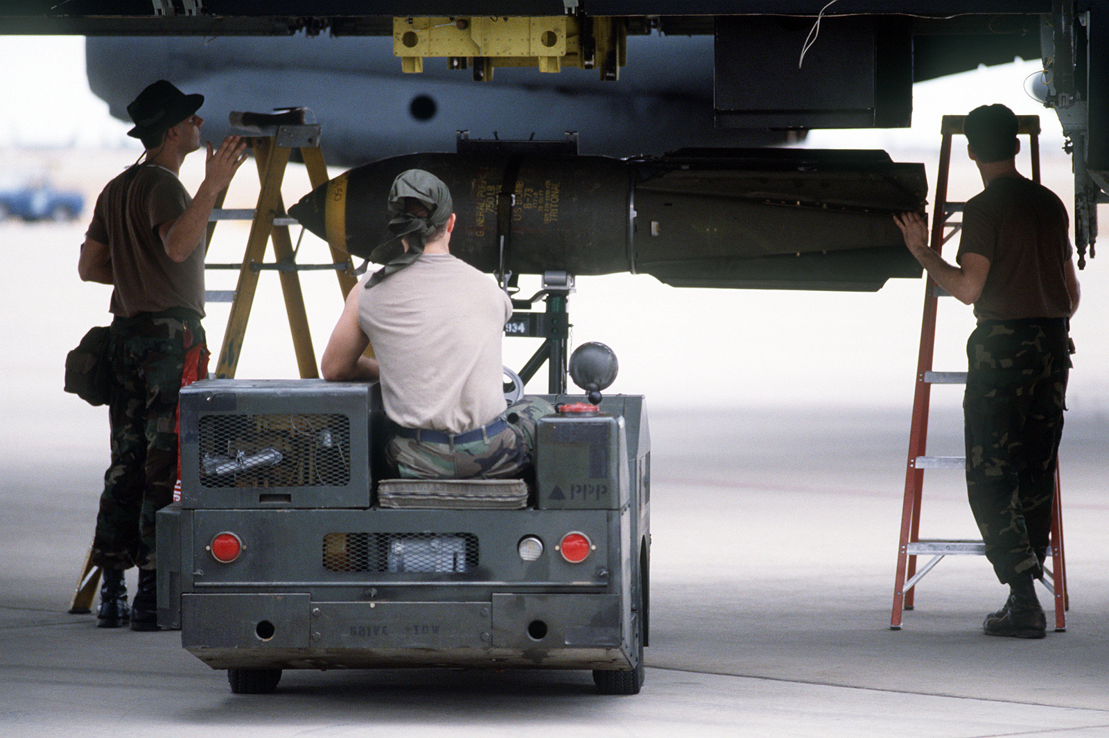 Members Of The 1708th Munitions Maintenance Squadron Use An MJ-1 Bomb ...