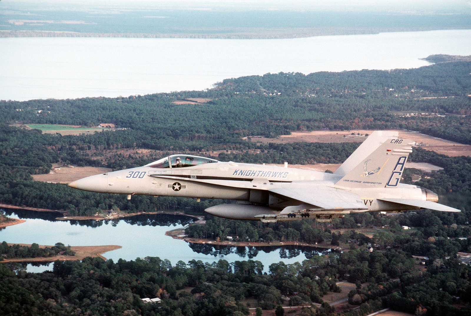 An air-to-air left side view of the Strike Fighter Squadron 136 (VFA ...