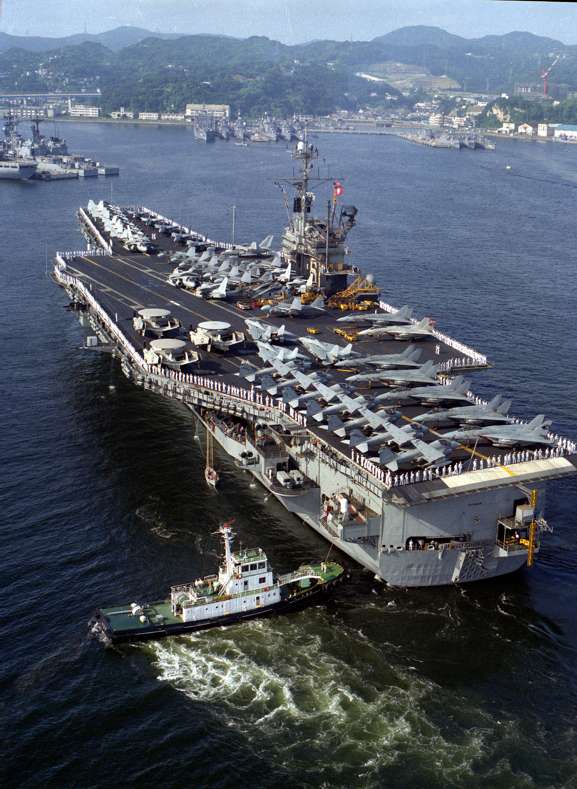 The Japanese Tug Azama Maneuvers The Aircraft Carrier Uss Ranger (Cv-61)  Into Port As The Vessel Visits Japan For The Last Time During Its Final  Deployment Prior To Decommissioning - Nara &