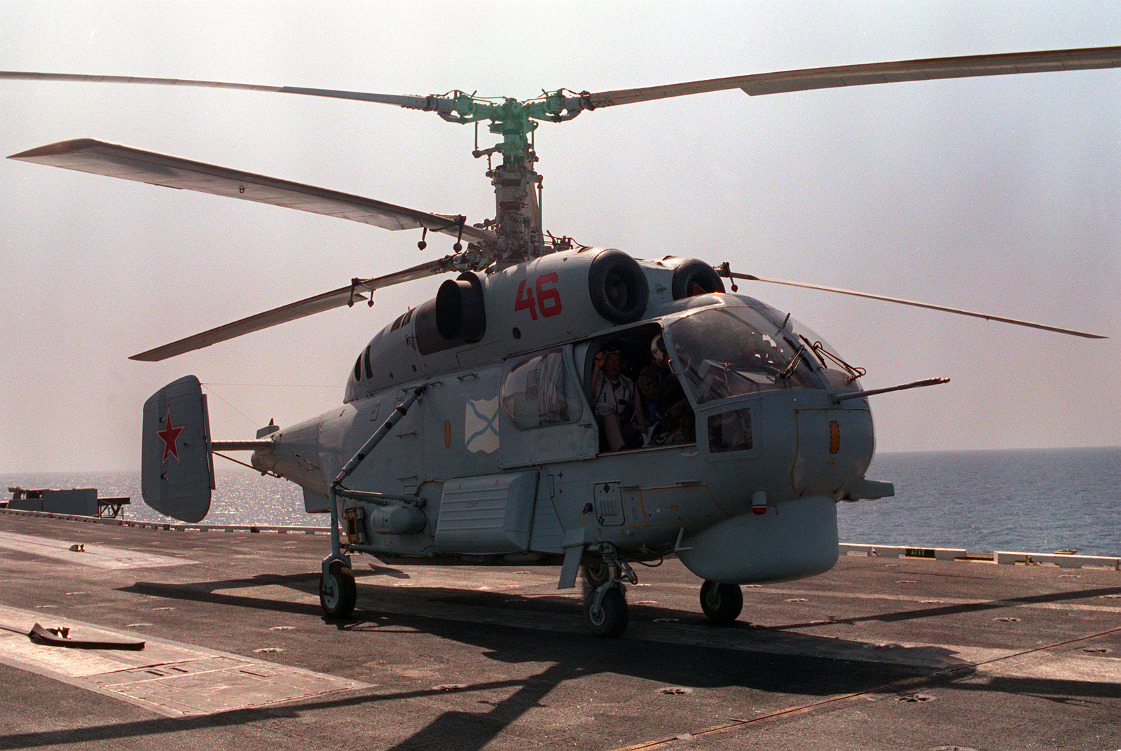 A Russian Ka-27 Helix helicopter prepares to take off from the flight deck of the aircraft carrier USS RANGER (CV-61) following a visit to the ship by helicopter crew members from the guided missile destroyer Admiral Vinogradov (BPK-554). Both the Vinogradov and RANGER are part of a multinational naval force participating in exercises in the region