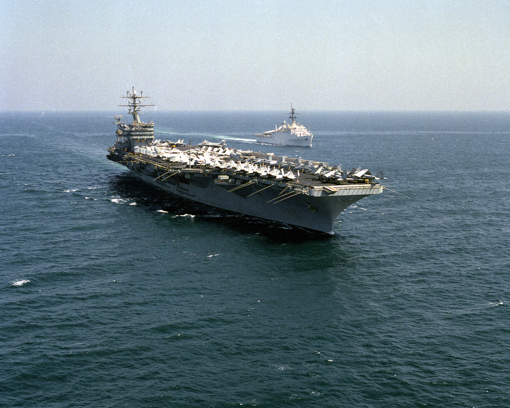 A starboard bow view of the nuclear-powered aircraft carrier USS NIMITZ ...