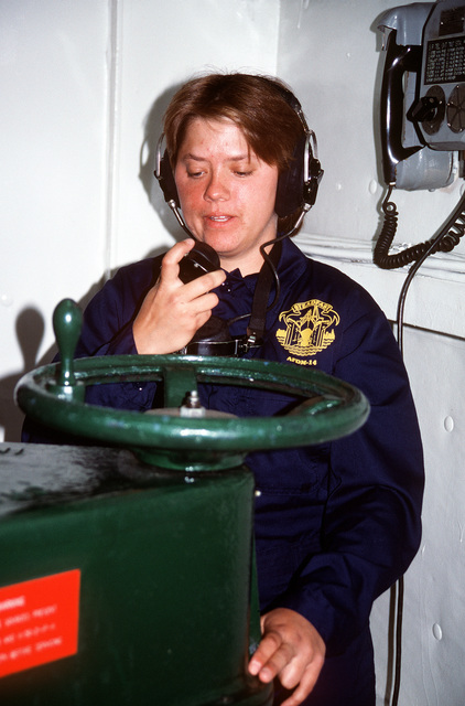 US Navy Engineman 2nd Class Anthony Bartelli (right) holds an