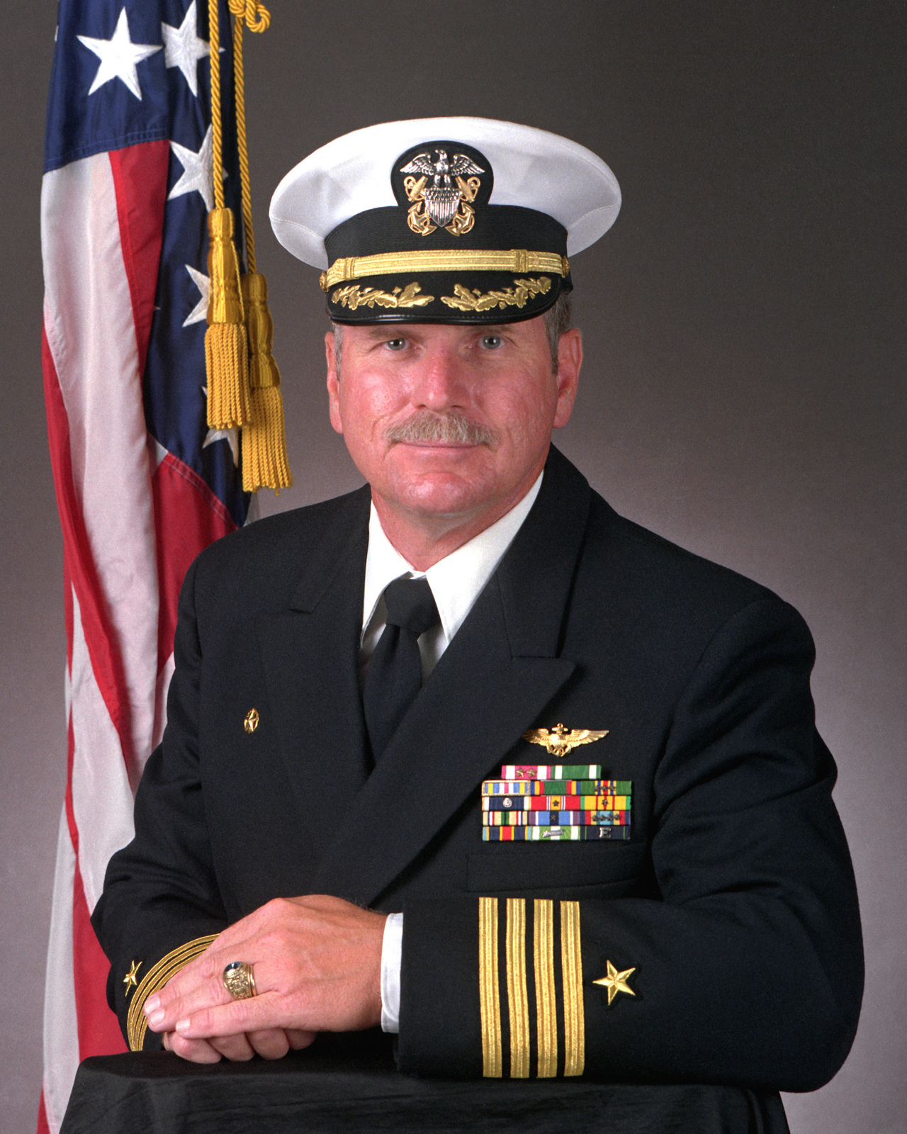 CAPT. James P. Butler, USN (covered) NARA & DVIDS Public Domain