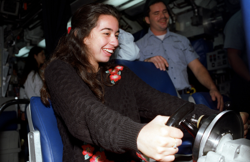 A Student Sits In A Diving Control Station Seat Aboard The