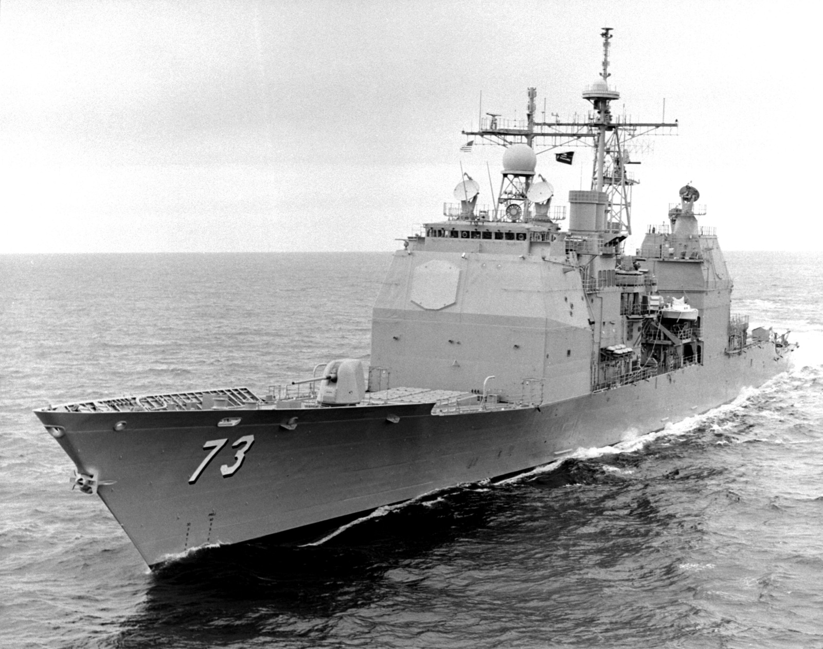 A low oblique port bow on view of the guided missile cruiser USS PORT ...