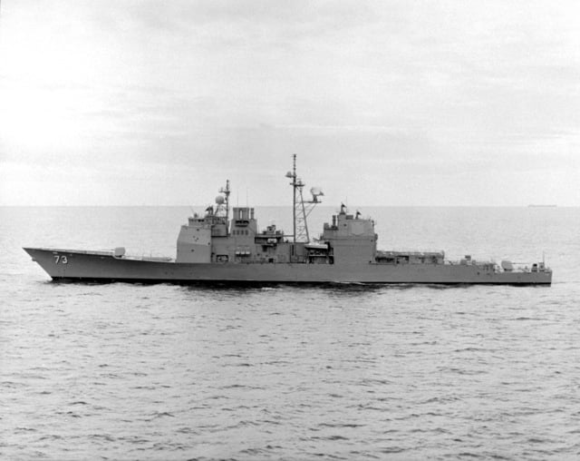 A low oblique port side view of the guided missile cruiser USS PORT ...