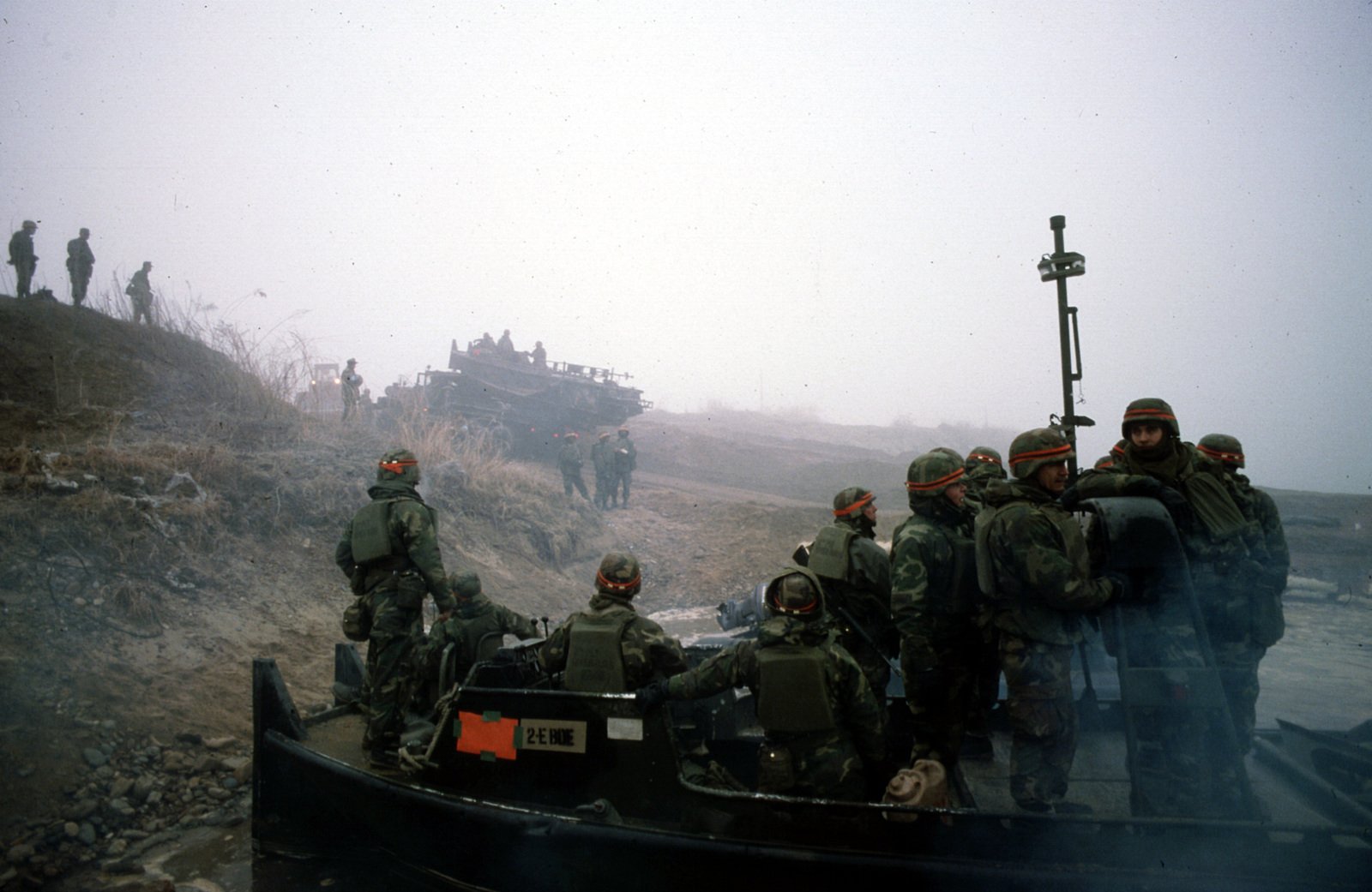 Soldiers from the 50th Engineers Assault Float Bridge Company wait on ...