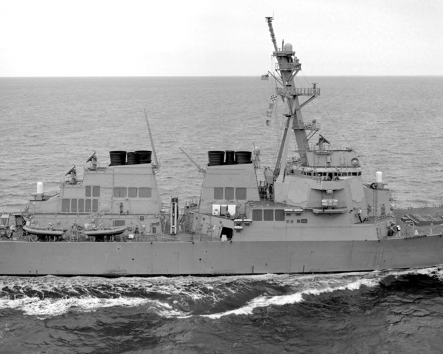 A starboard beam view of the amidships section of the guided missile ...