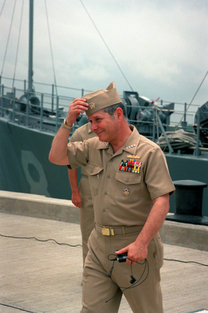 Informal full-length portrait of the CHIEF of Naval Operations, Admiral  Jeremy M. Boorda, USN, in dress white formal uniform. Photograph was taken  on the first floor of his official residence. (Exact date