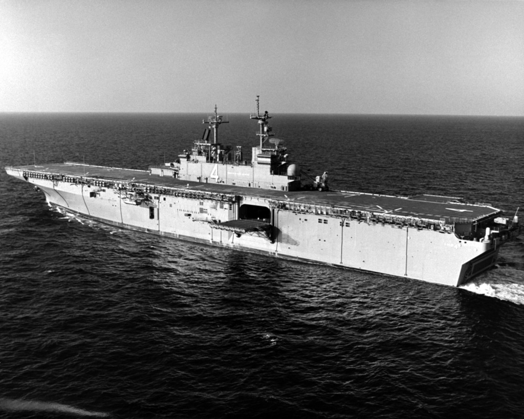 An aerial high oblique port quarter view of the amphibious assault ship ...