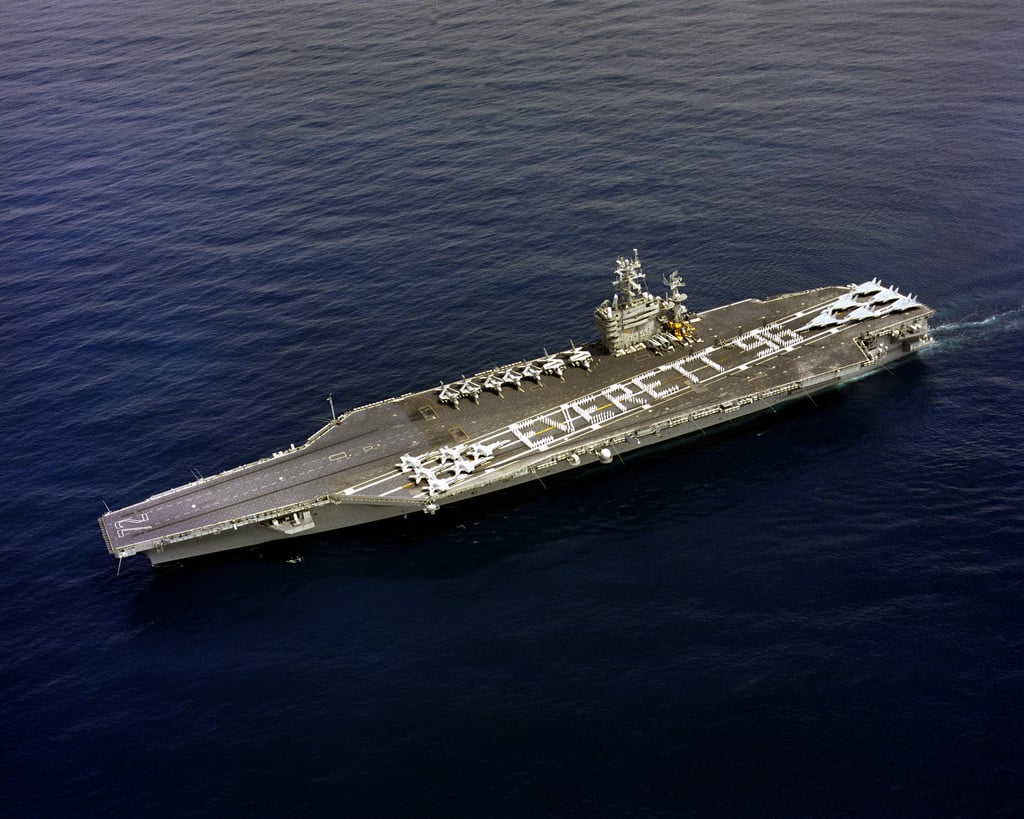 An aerial port quarter view of the nuclear-powered aircraft carrier USS ...