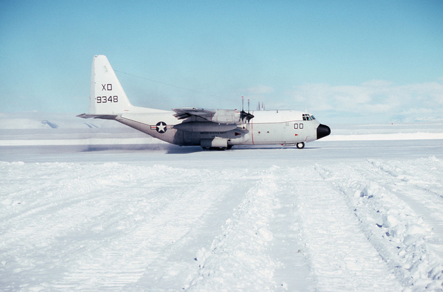 Right side view of a C-130T Hercules aircraft taxiing down the runway ...