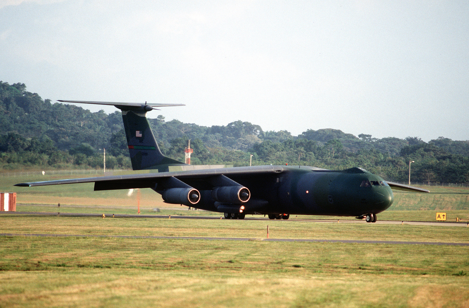 A right side medium shot of a U.S. Air Force C-141 Starlifter as it ...