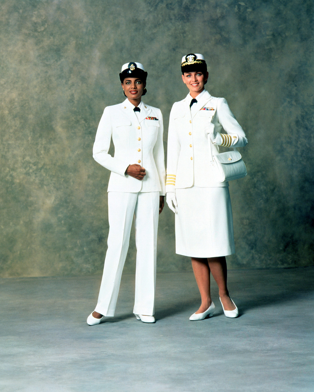 Right, Service Dress White uniform for women officers. 