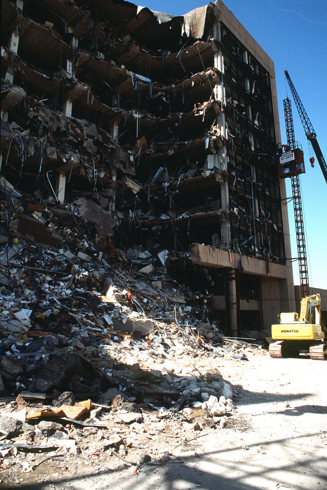 Oklahoma City Bombing. Construction workers erect an external elevator ...