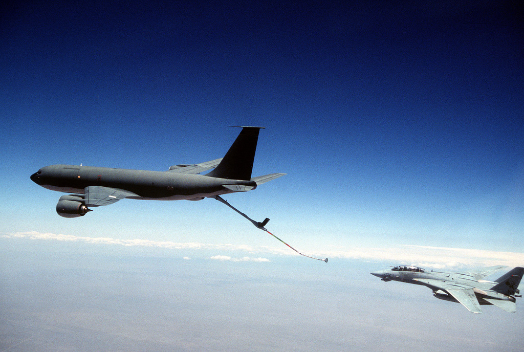 A side view of a KC-135 Stratotanker refueling an F-14 Tomcat from VF-31,  Miramar Naval Air Station, CA - PICRYL - Public Domain Media Search Engine  Public Domain Search