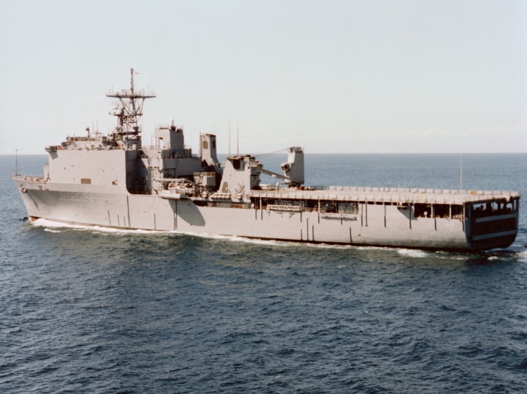 Low oblique port quarter view of the dock landing ship USS HARPERS ...