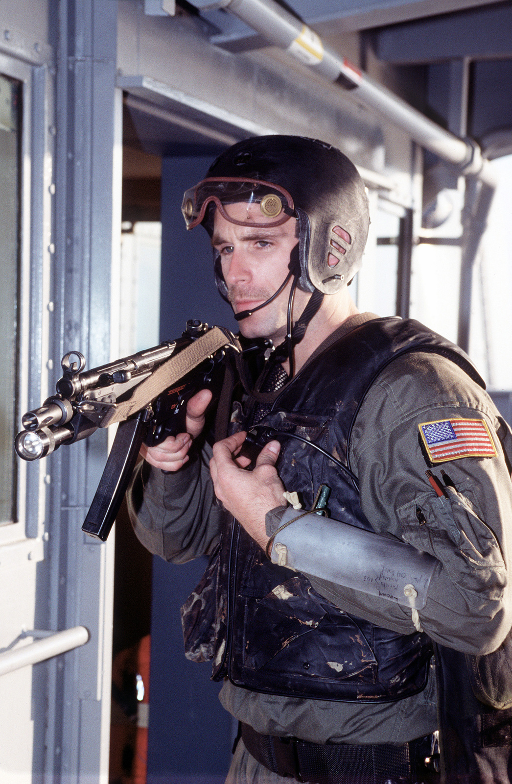 A Us Navy Seal Armed With An Mp5 N Sub Machine Gun Sets Up A