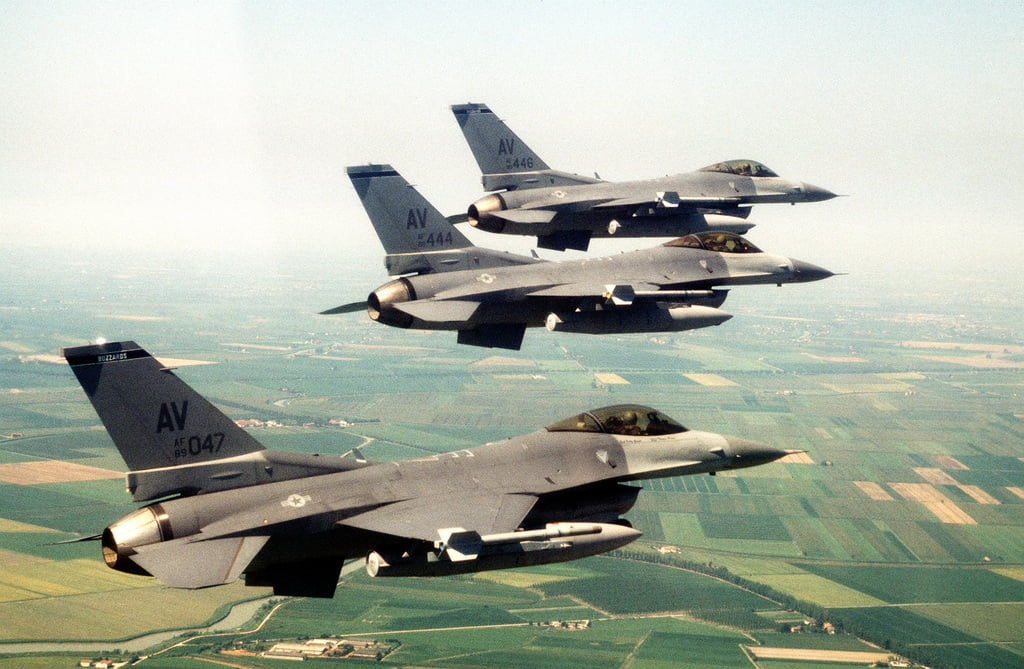 An air to air right side view of three US Air Force F-16C Fighting ...