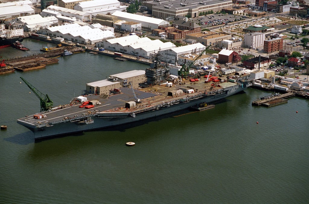 An aerial port bow view of the nuclear-powered aircraft carrier JOHN C ...