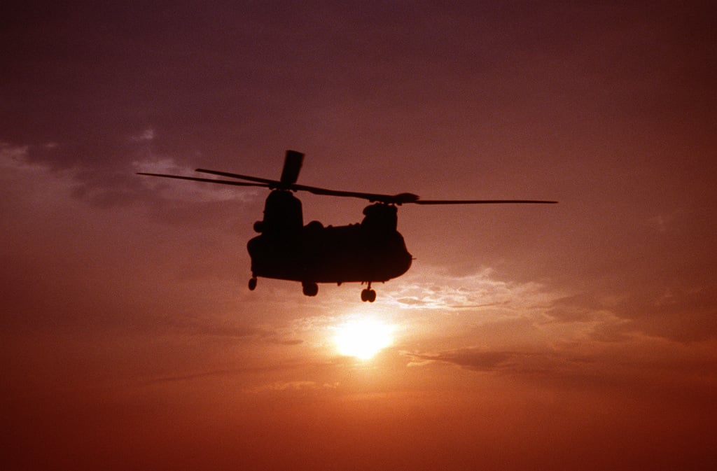 A Silhouette Of An Us Army Ch 47d Chinook Helicopter In The Sunset The Army Helicopter From E Company 502nd Aviation Regiment Aviano Italy Is Practicing Landings And Take Offs From The Deck Of - ch 47a chinook air ambulance roblox