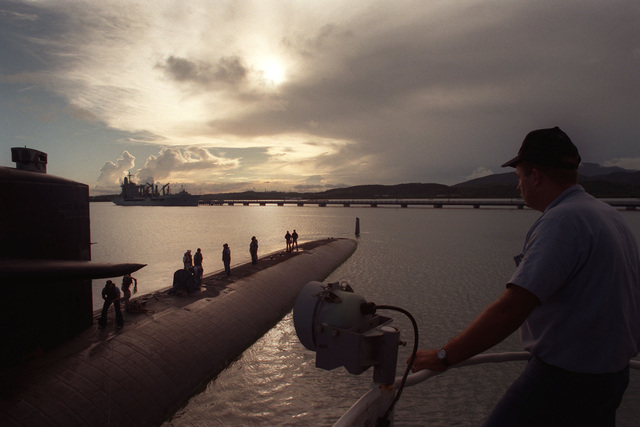 US Navy Engineman 2nd Class Anthony Bartelli (right) holds an