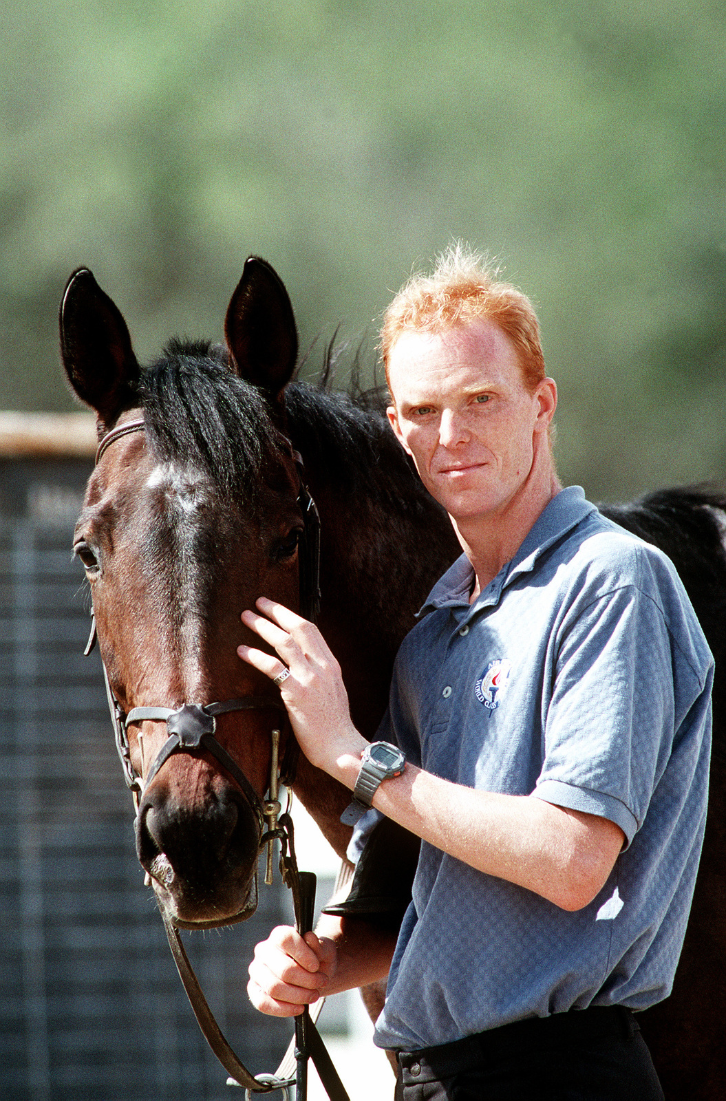 CAPT. Dirk J. Bouma poses next to his horse at the equestrian center ...