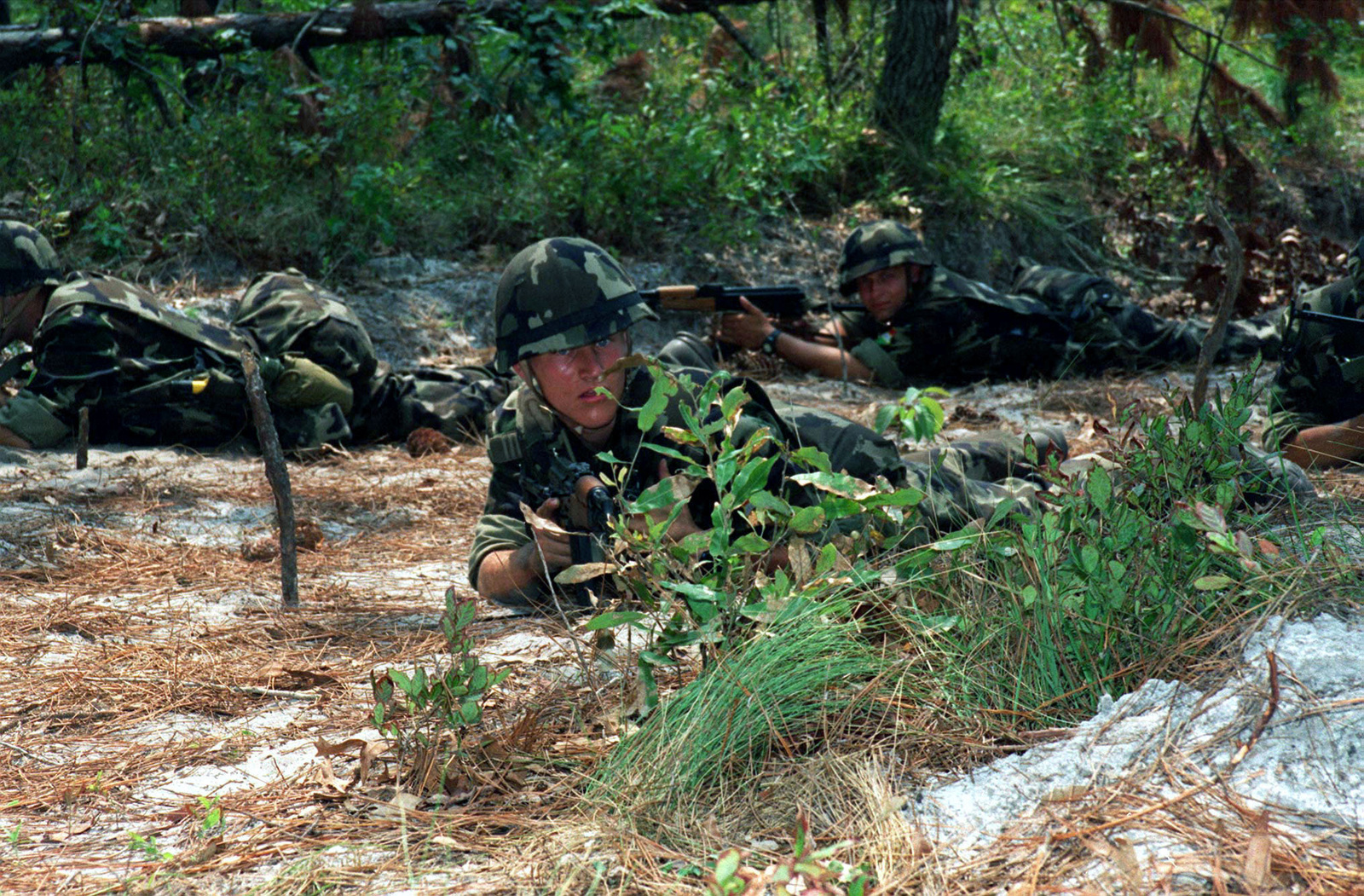 A medium close view of Hungarian Soldiers lying on the ground in a ...