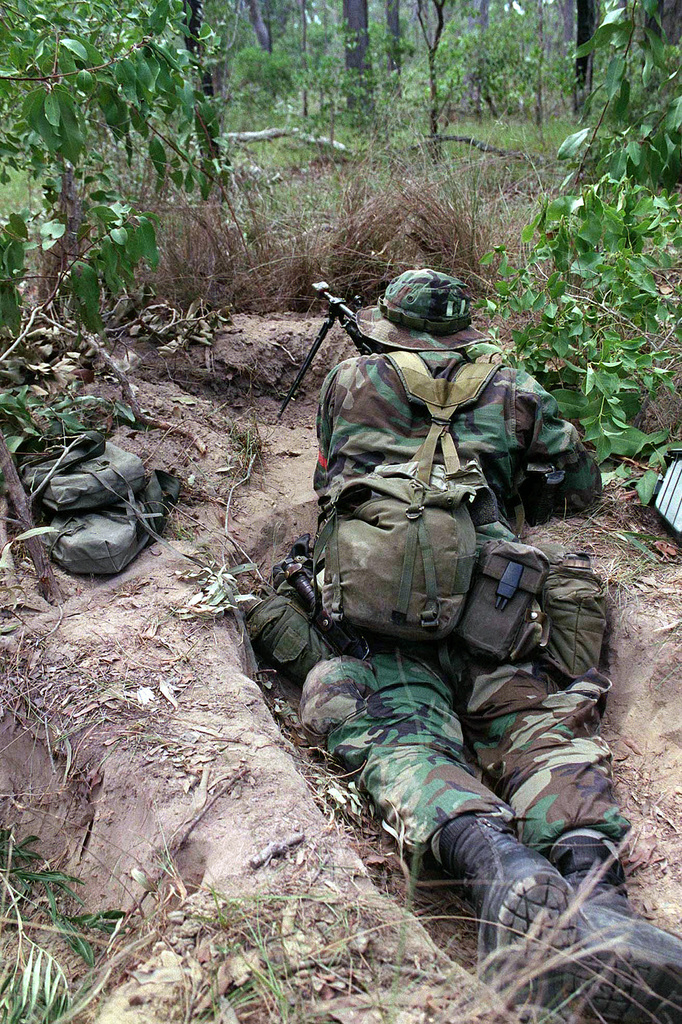 A soldier, from Texas Army National Guard, guards the rear position ...