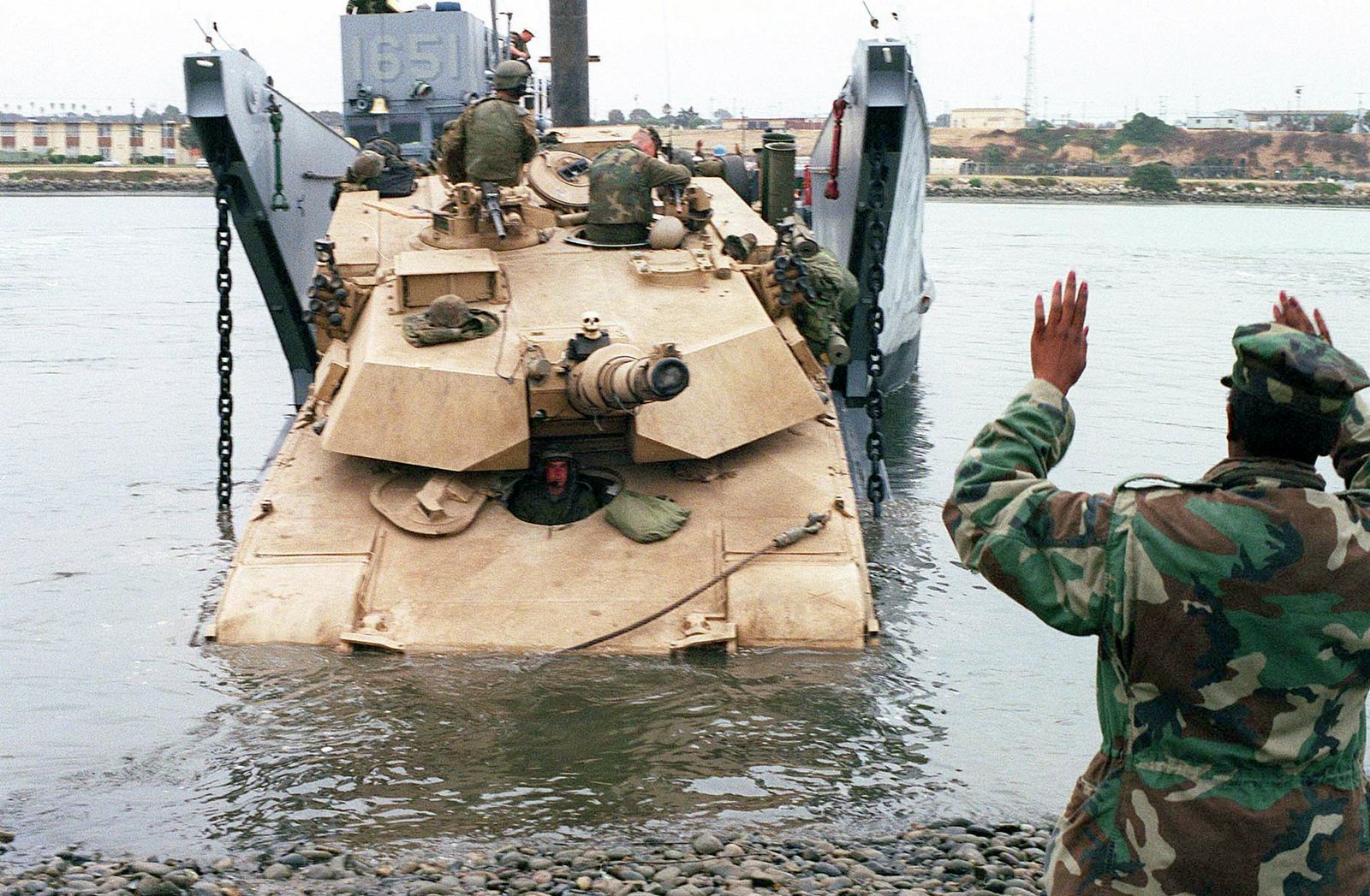 Lance Corporal Rahsaan Green Directs The Onload Of An Abrams M1A1 Main ...