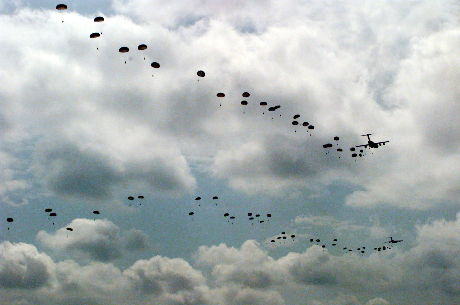 The sky is filled with parachutes after soldiers from the U.S. Army's ...