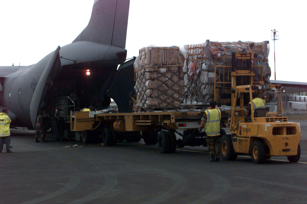 On the airport ramp a K-loader is moved into position to ...