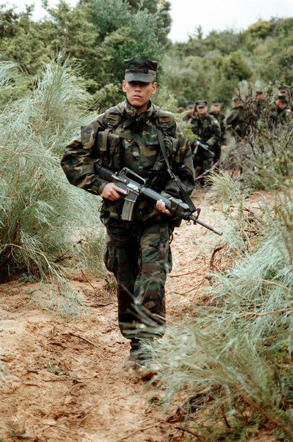 Armed with an M16A2 semi-automatic rifle, Lance Corporal Conrado ...