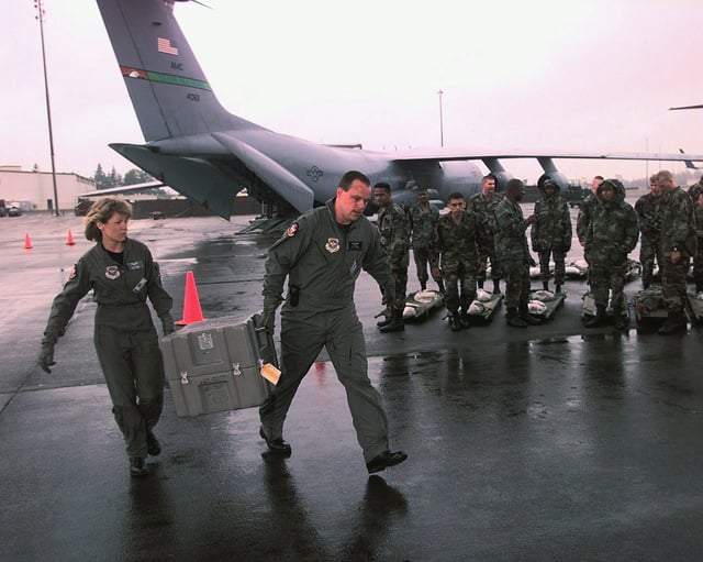 West Virginia Air National Guard (WVANG) Captain (CPT) Cara Simms (left ...